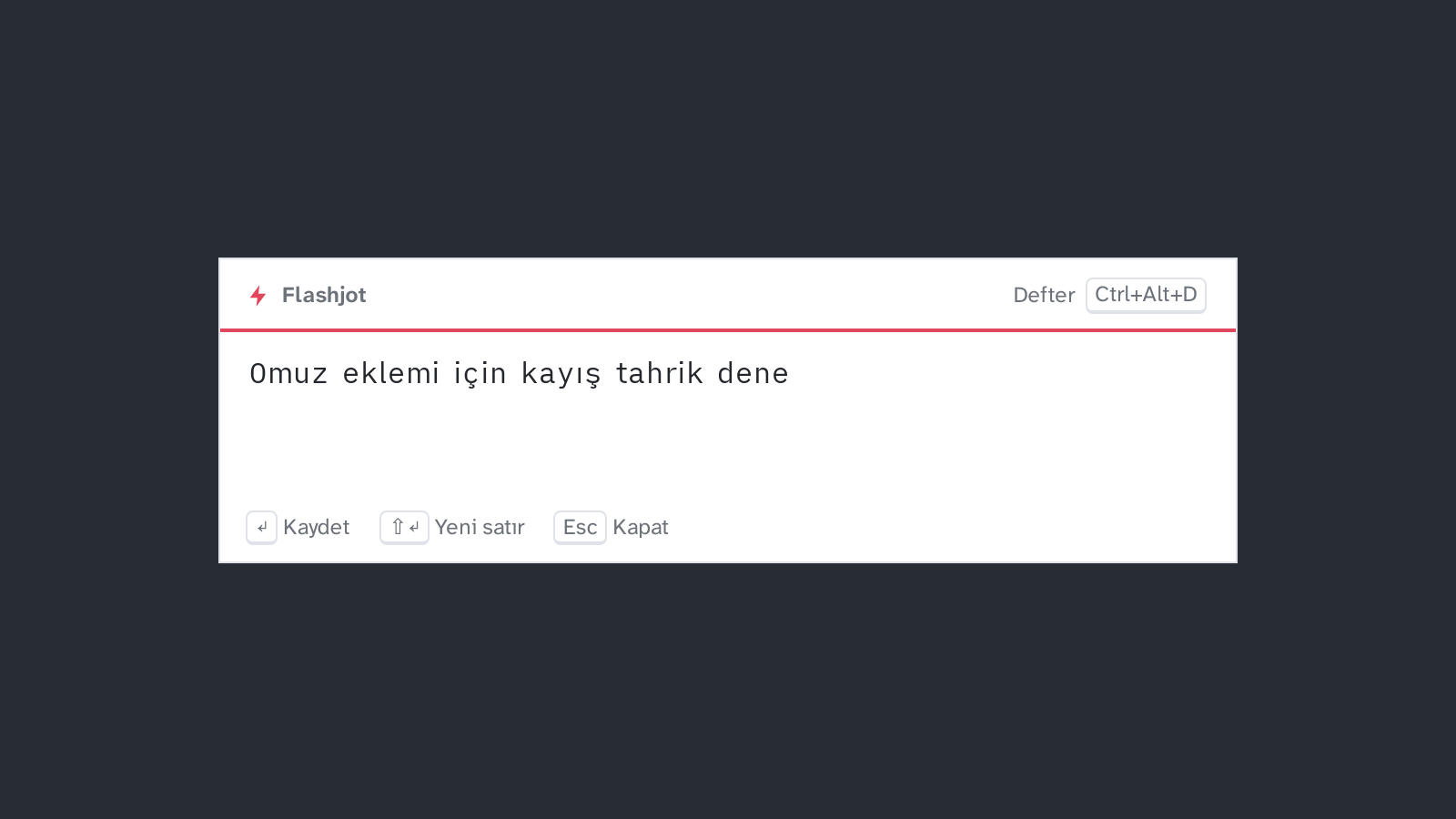 Masaüstünün üstünde hızlı kutu: Flashjot başlığının altında kırmızı çizgi olan beyaz bir kart ve “Omuz eklemi için kayış tahrik dene” yazısı